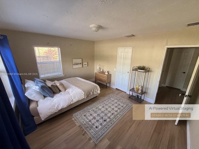 bedroom featuring a closet and hardwood / wood-style flooring