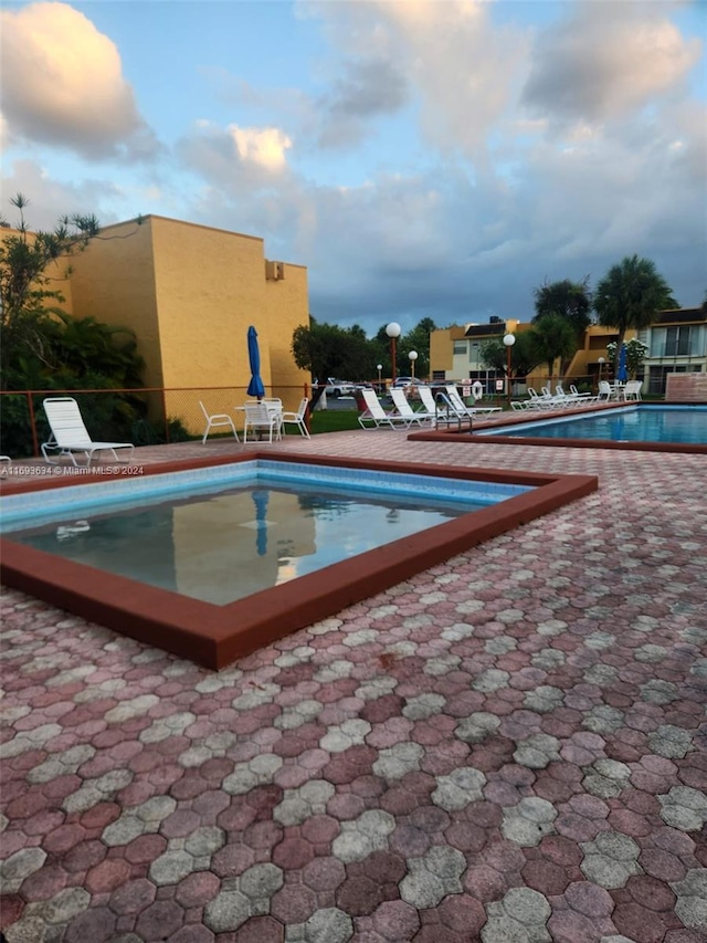 view of pool featuring a patio