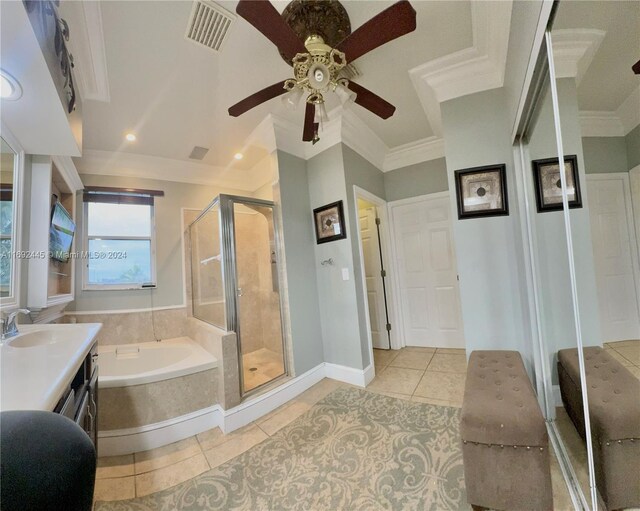 bathroom featuring vanity, tile patterned floors, crown molding, ceiling fan, and shower with separate bathtub