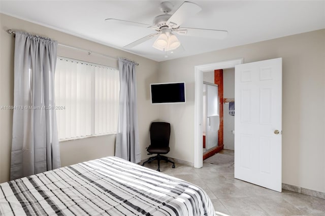 bedroom with ceiling fan and light tile patterned flooring