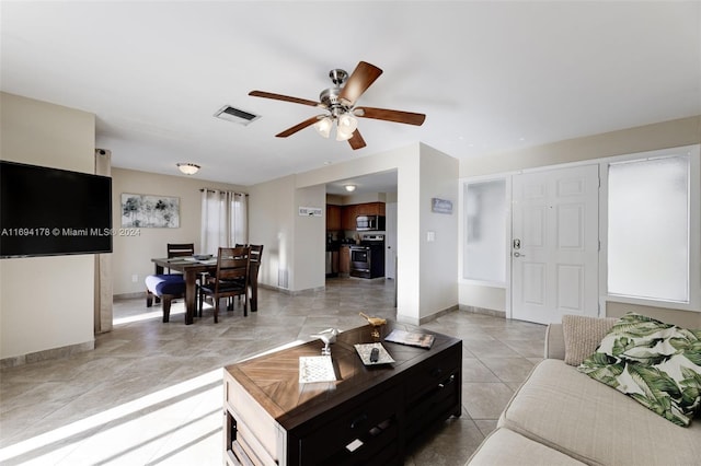 living room with ceiling fan