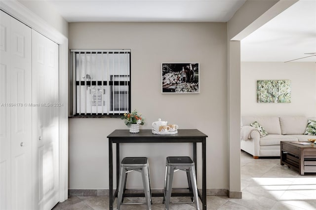 interior space featuring ceiling fan