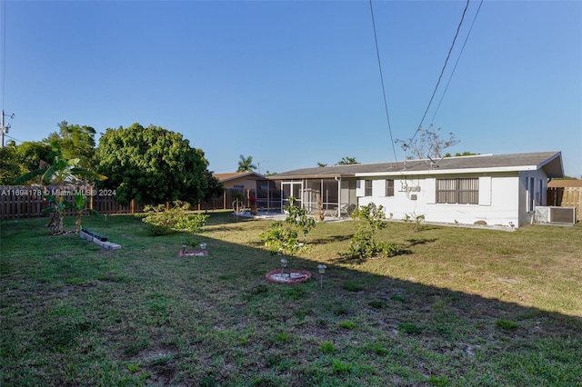 view of yard featuring a sunroom