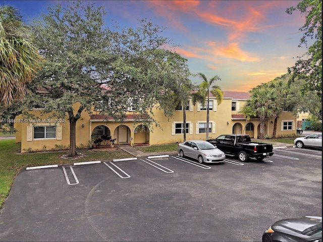 view of parking at dusk