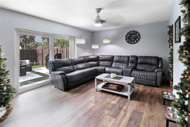 10710 La Placida Dr Unit 6-6, Coral Springs, FL 33065 - living room featuring ceiling fan, wood finished floors, and a textured ceiling