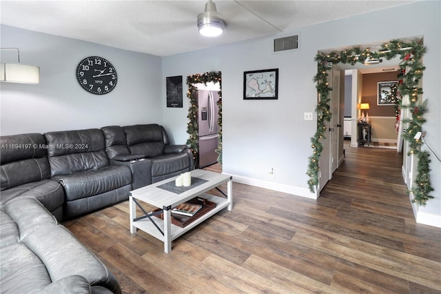 10710 La Placida Dr Unit 6-6, Coral Springs, FL 33065 - living area with wood finished floors, ceiling fan, baseboards, and a textured ceiling