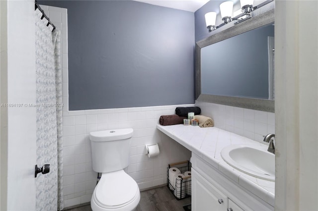 10710 La Placida Dr Unit 6-6, Coral Springs, FL 33065 - bathroom with vanity, tile walls, toilet, a wainscoted wall, and wood finished floors