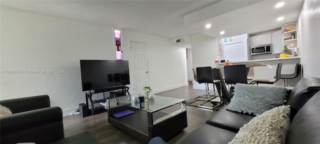 living room featuring dark hardwood / wood-style flooring