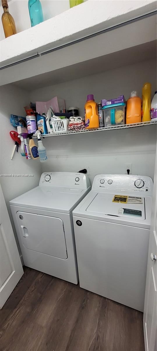 washroom featuring separate washer and dryer and dark wood-type flooring