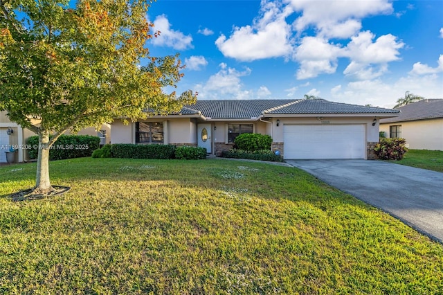 ranch-style home with a front yard, an attached garage, stucco siding, concrete driveway, and a tile roof