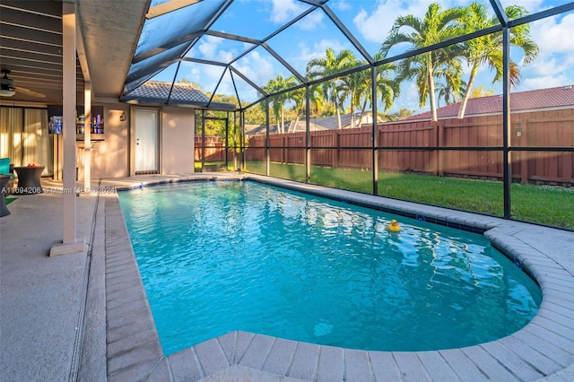 view of swimming pool with a lanai