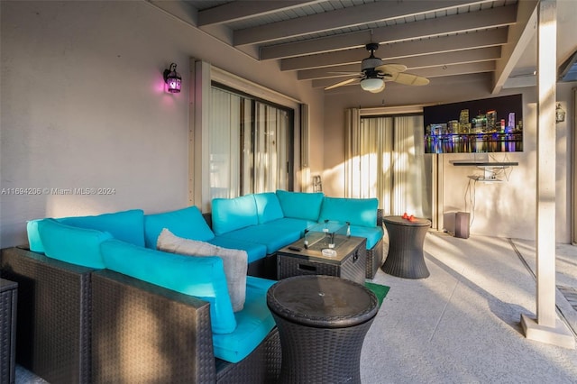 view of patio with an outdoor living space and ceiling fan