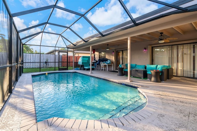 view of swimming pool featuring a lanai, an outdoor living space, ceiling fan, and a patio