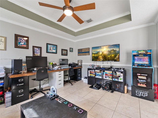 office featuring ceiling fan, light tile patterned floors, crown molding, and a tray ceiling