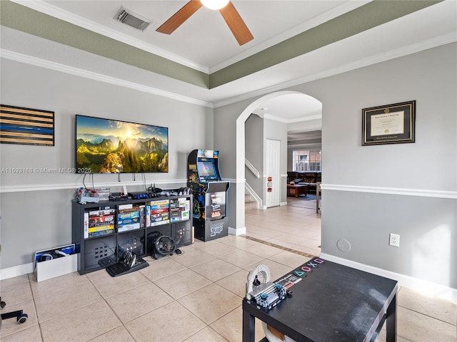 interior space featuring tile patterned floors, ceiling fan, and crown molding