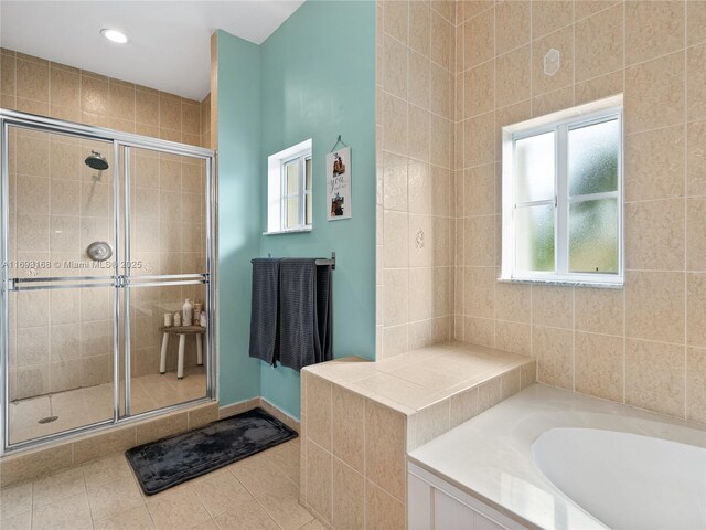 bathroom featuring tile patterned floors and plus walk in shower