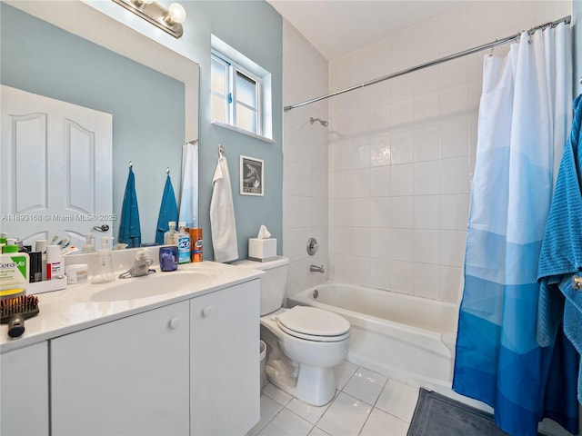 full bathroom featuring tile patterned flooring, shower / tub combo, vanity, and toilet