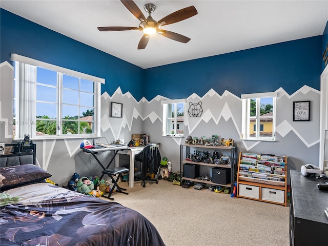 carpeted bedroom featuring ceiling fan