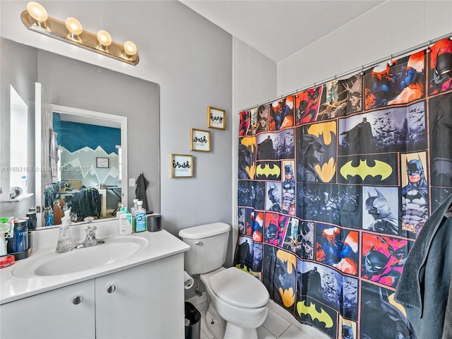 bathroom featuring walk in shower, tile patterned flooring, vanity, and toilet