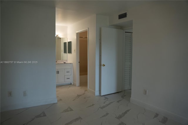 unfurnished bedroom with visible vents, baseboards, and marble finish floor