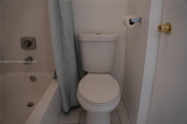 bathroom with tile patterned floors and toilet