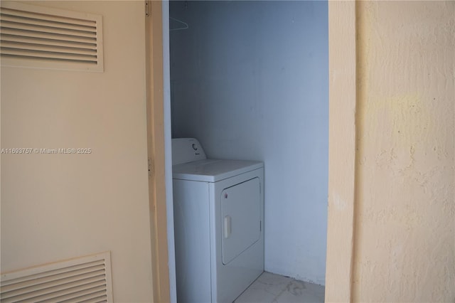 washroom with washer / clothes dryer, marble finish floor, and laundry area