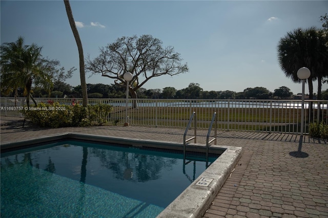 pool featuring a patio and fence