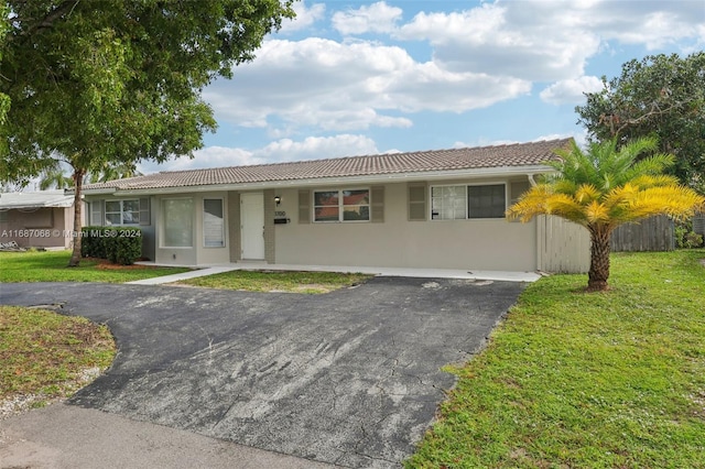 ranch-style house with a front yard