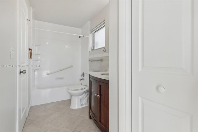 full bathroom with tile patterned floors, vanity, toilet, and washtub / shower combination