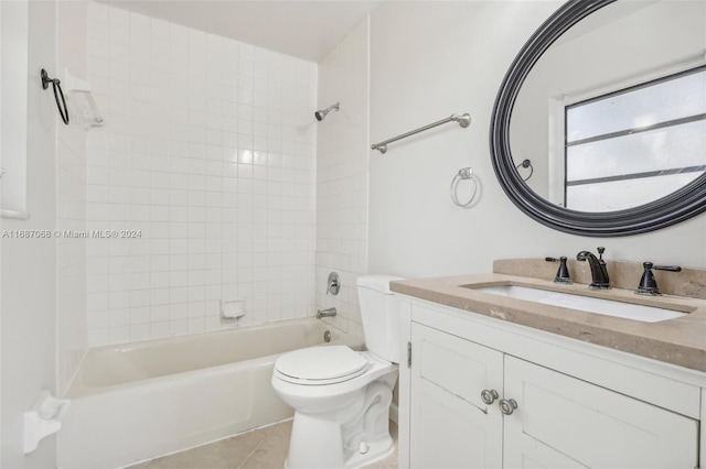 full bathroom with tile patterned flooring, vanity, toilet, and tiled shower / bath