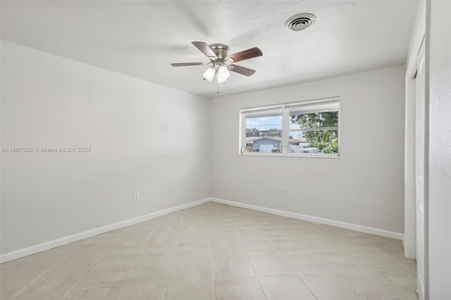 unfurnished bedroom with ceiling fan and light tile patterned flooring