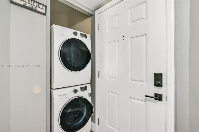 laundry area with stacked washer / drying machine