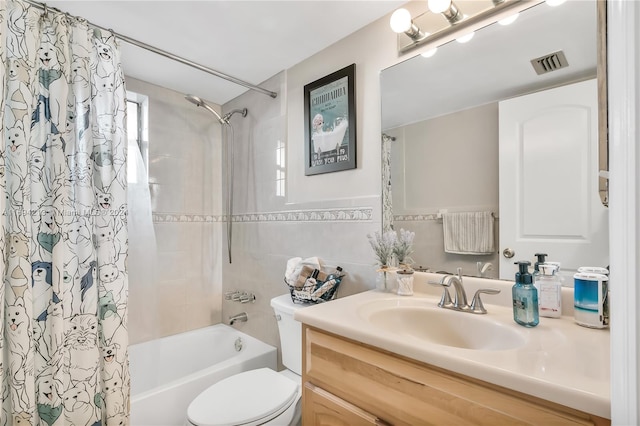 full bathroom with vanity, shower / bathtub combination with curtain, toilet, and tile walls