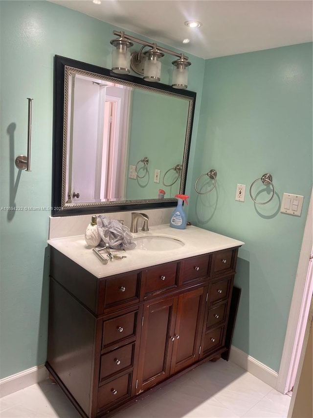 bathroom with tile patterned floors and vanity