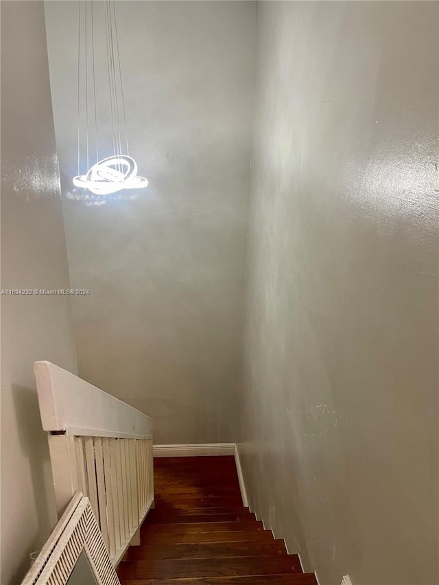 stairway featuring hardwood / wood-style flooring