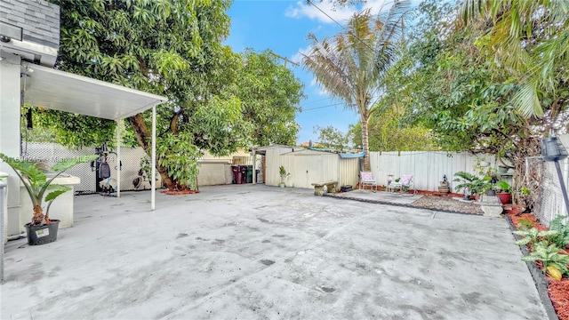 view of patio with a storage shed