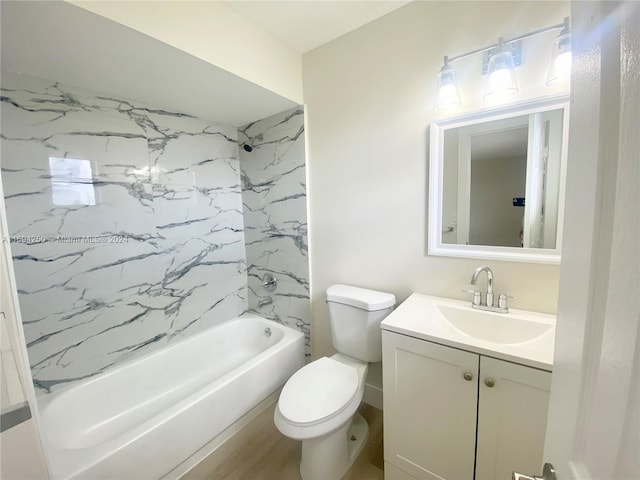 full bathroom with tiled shower / bath, hardwood / wood-style flooring, vanity, and toilet