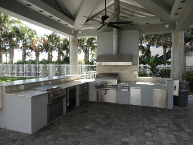 view of patio / terrace featuring an outdoor kitchen, grilling area, and ceiling fan