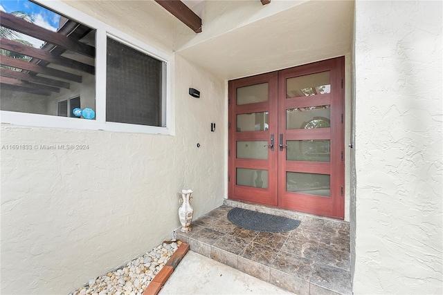 entrance to property featuring french doors