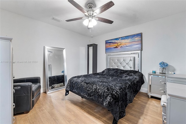 bedroom featuring light wood-type flooring and ceiling fan