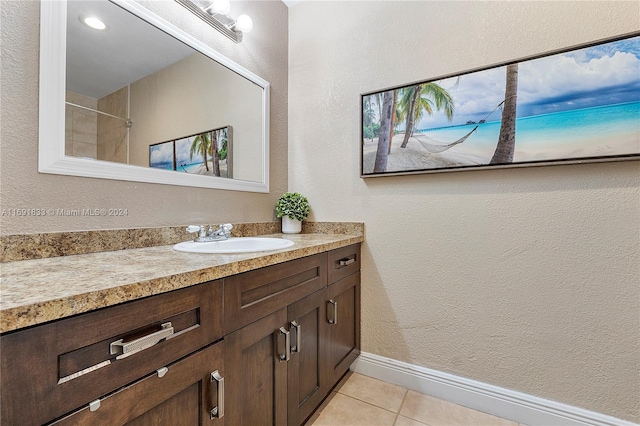 bathroom featuring tile patterned floors and vanity