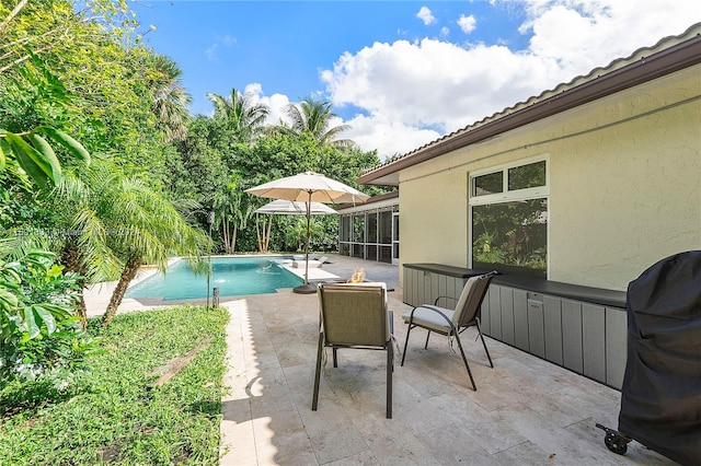 view of swimming pool featuring a patio area