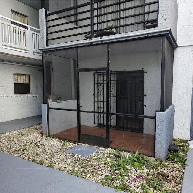 doorway to property featuring a balcony