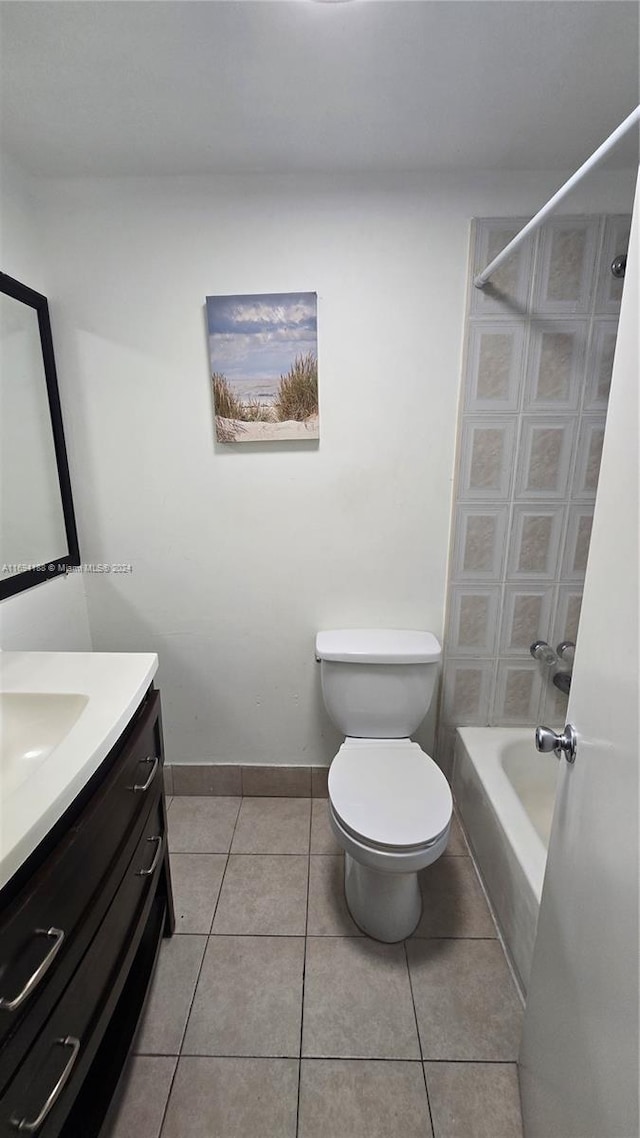 full bathroom featuring tile patterned flooring, vanity, toilet, and washtub / shower combination