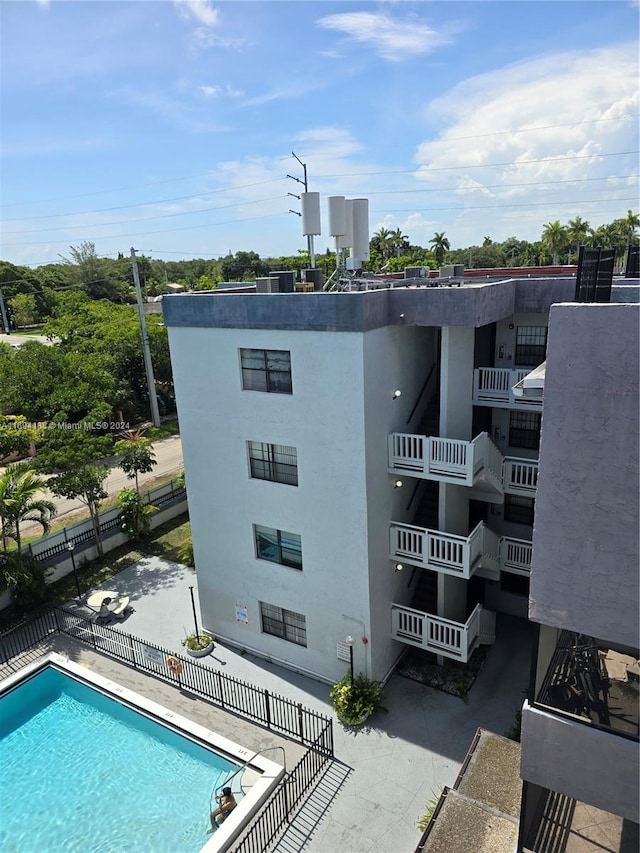 view of property with a community pool