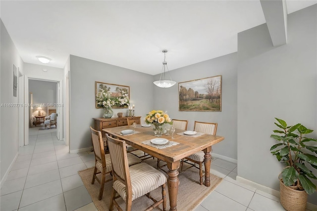 dining area with light tile patterned floors