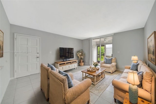 tiled living room with ceiling fan