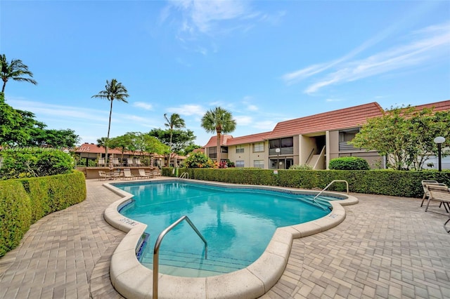 view of swimming pool featuring a patio