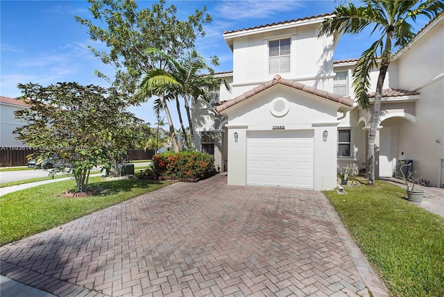 mediterranean / spanish-style house with a front lawn