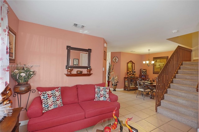 tiled living room featuring a chandelier